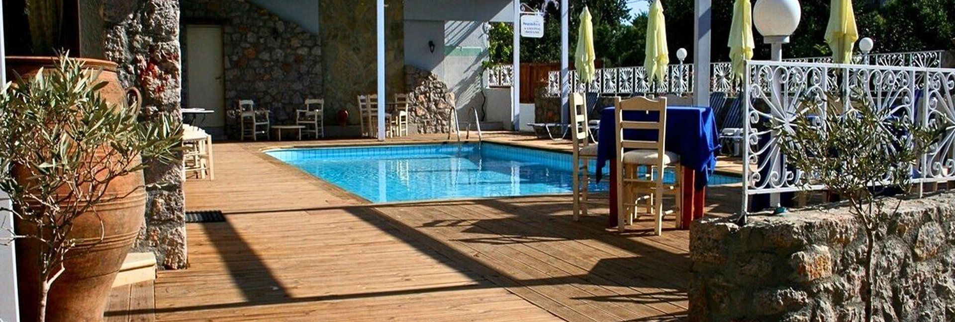 Swimming pool and restaurant facilities at Naiades Almiros River Hotel in Almiros, Agios Nikolaos